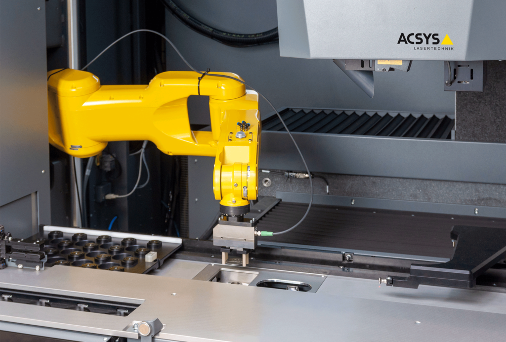 Robot handling (here: pick and place) of sensitive components during laser processing
